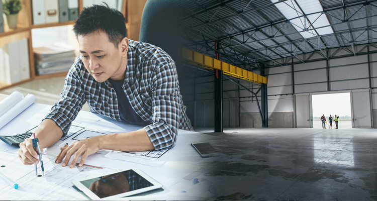 a man holding a compass and an empty warehouse in the background