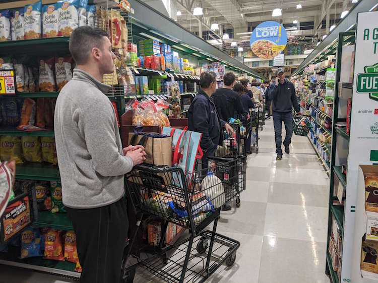 When going grocery shopping, take the queue behind the fullest trolley